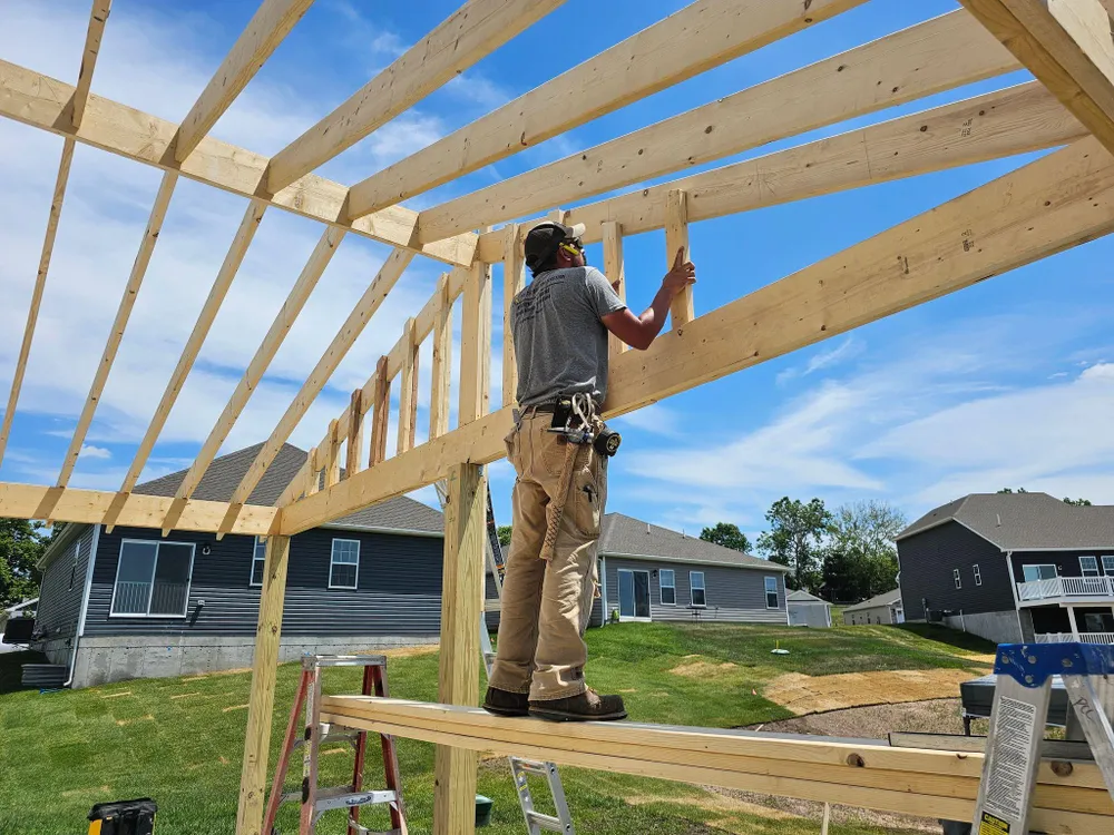 man building a house