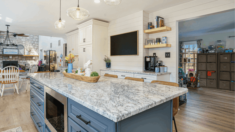 Modern kitchen remodel with white shaker cabinets, granite countertops, blue island, and open shelving by Pottstown Construction