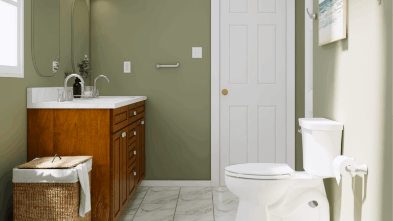 Modern bathroom remodel with sage green walls, wood vanity, white quartz countertop, and marble tile flooring