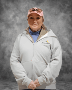 Pottstown Construction Company team member in branded white jacket and pink cap
