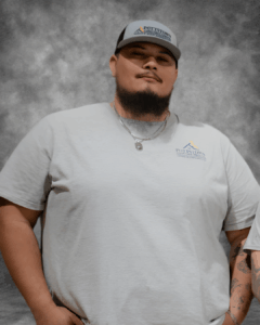 Pottstown Construction Company team member wearing branded cap and shirt, representing professional home renovation and construction services