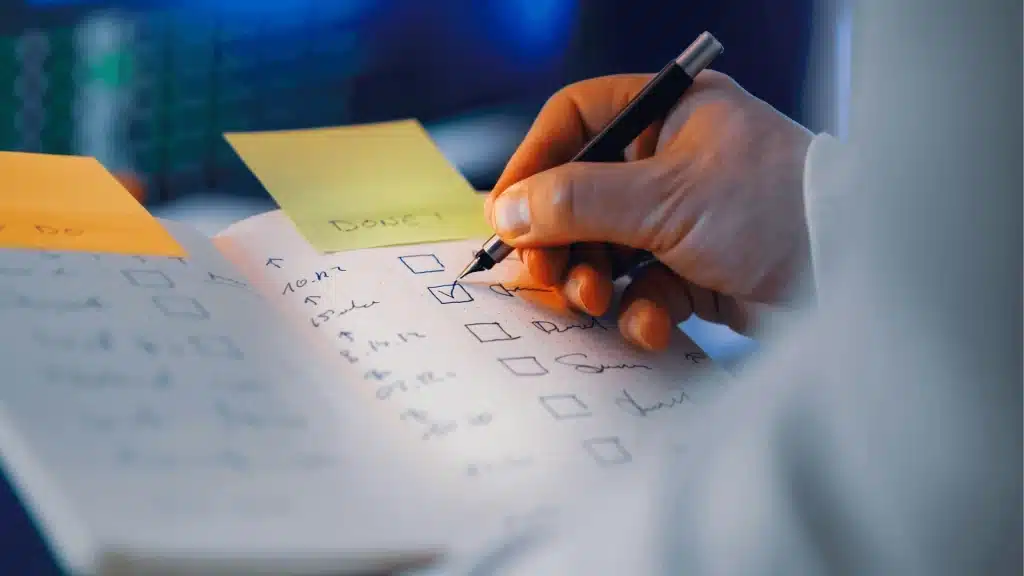 Construction project planning with checklist, sticky notes, and pen for home renovation management