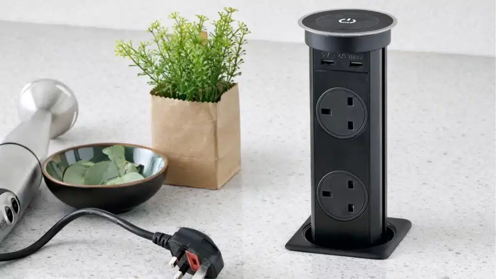 Modern pop-up kitchen power strip with USB ports on white marble countertop