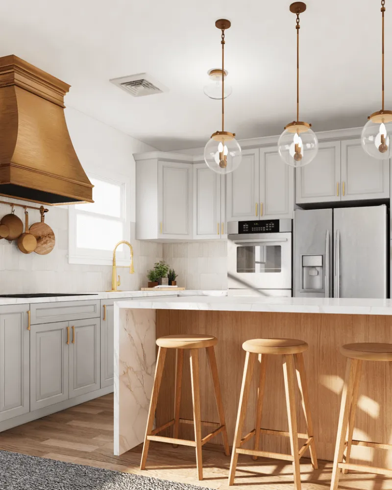 Modern kitchen remodel with white shaker cabinets, bronze pendant lights, wood island, and stainless steel appliances