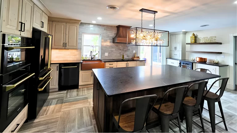 Modern kitchen remodel with custom cabinetry, quartz island countertops, subway tile backsplash, and black appliances