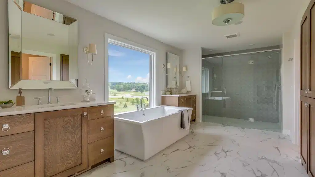 Spacious bathroom with glass enclosure and marble floors