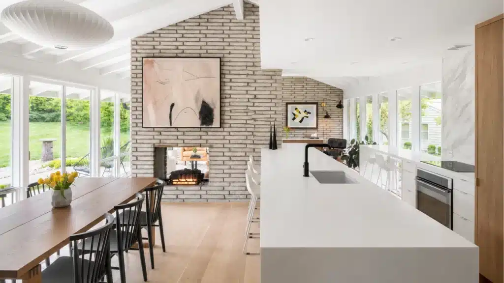 Spacious kitchen with brick statement wall