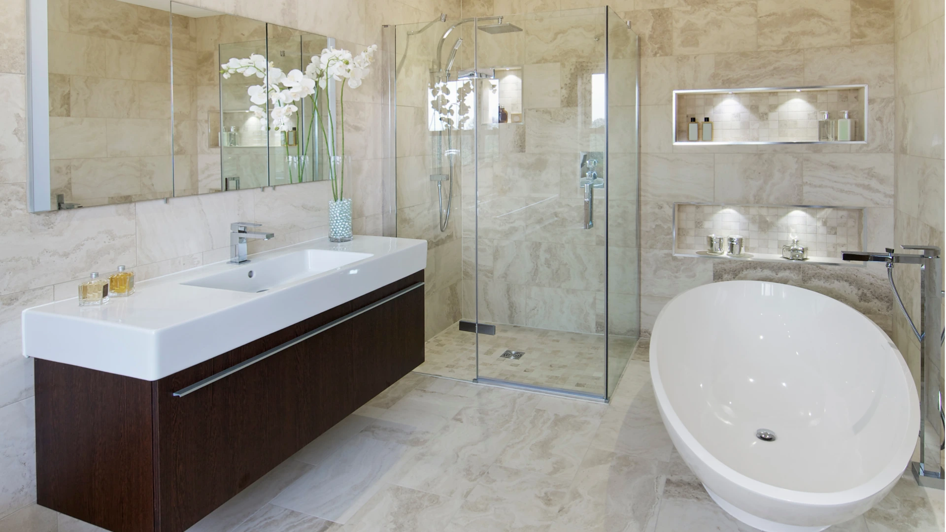 Blog 62 Luxury bathroom remodel with marble tile, freestanding soaking tub, frameless glass shower, and double vanity