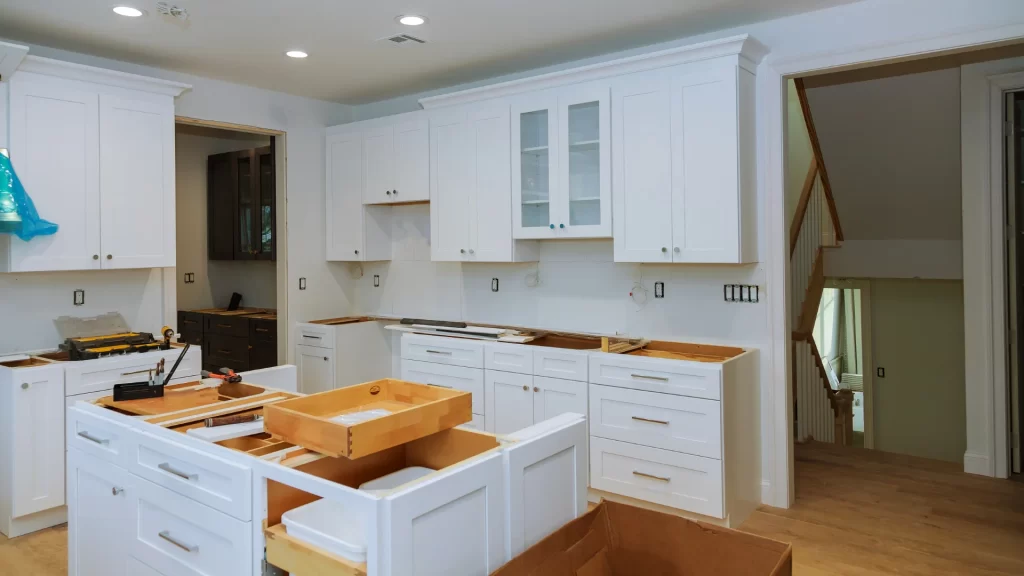 Kitchen remodel in progress with custom white shaker cabinets and wood countertops installation by Pottstown Construction Company.